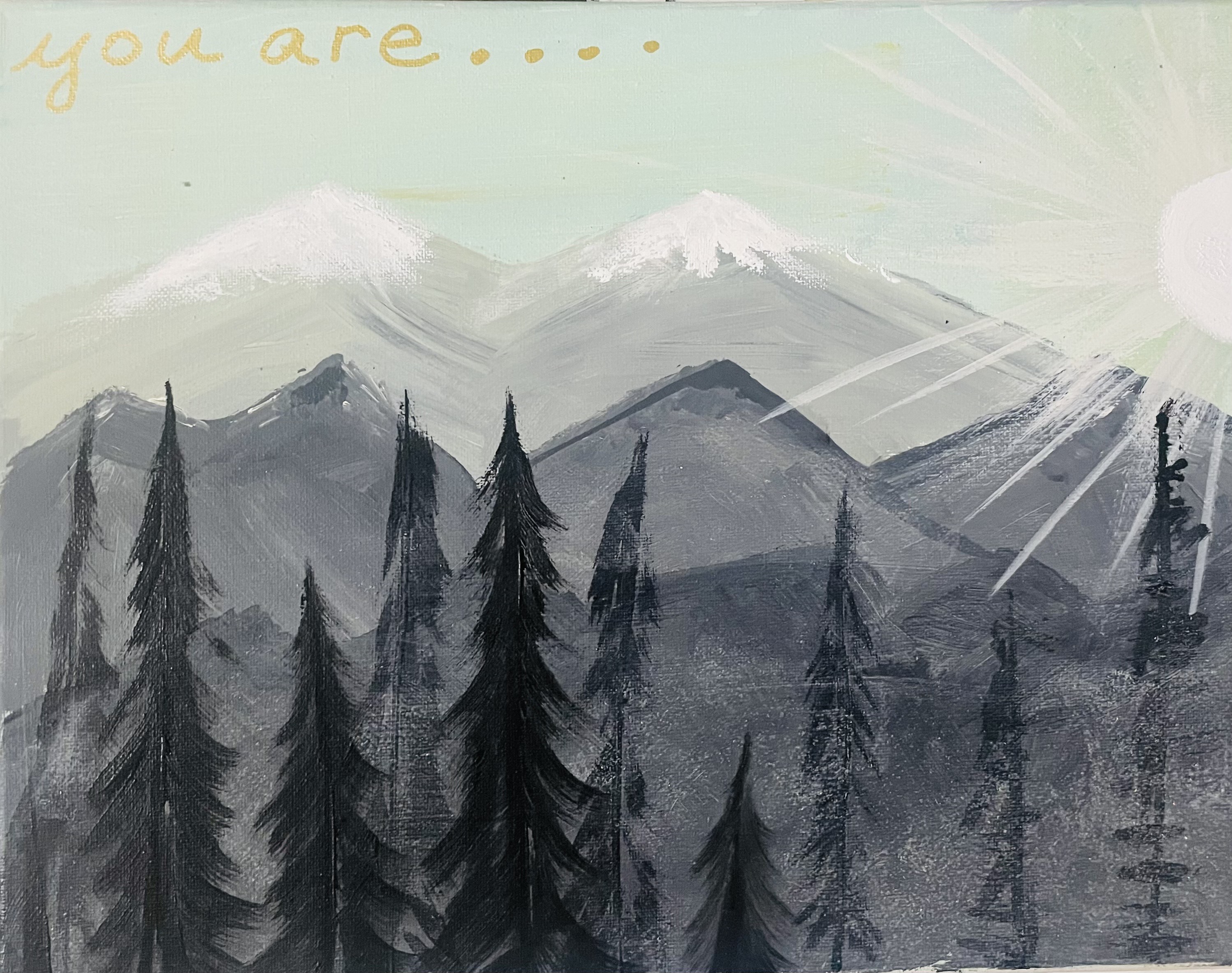 Mountain scene with layered pine trees and snowy peaks under turquoise sky