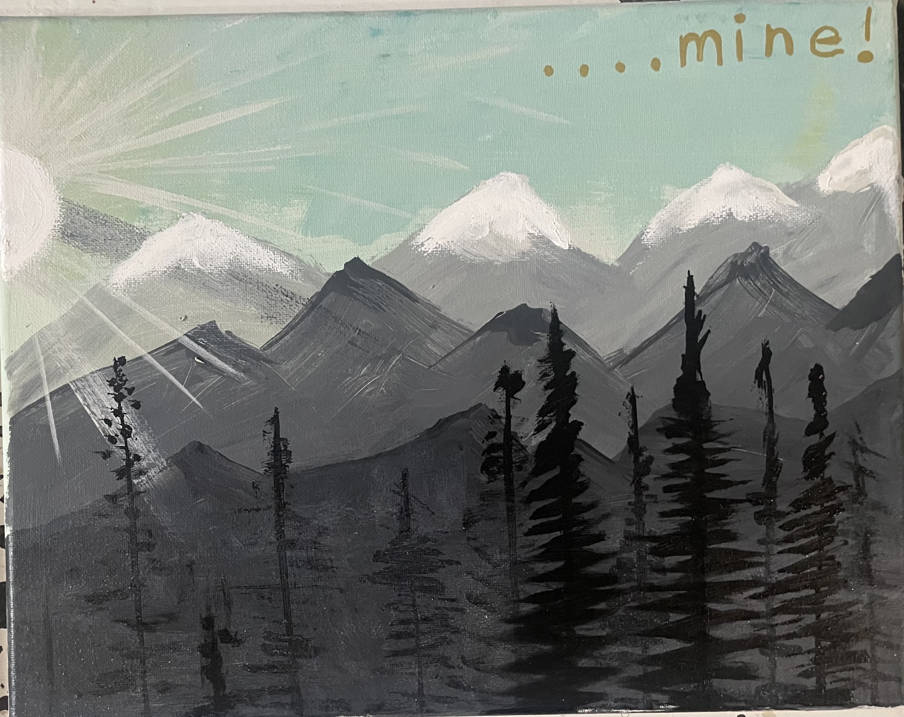 Atmospheric mountain vista with pine trees and misty gray peaks